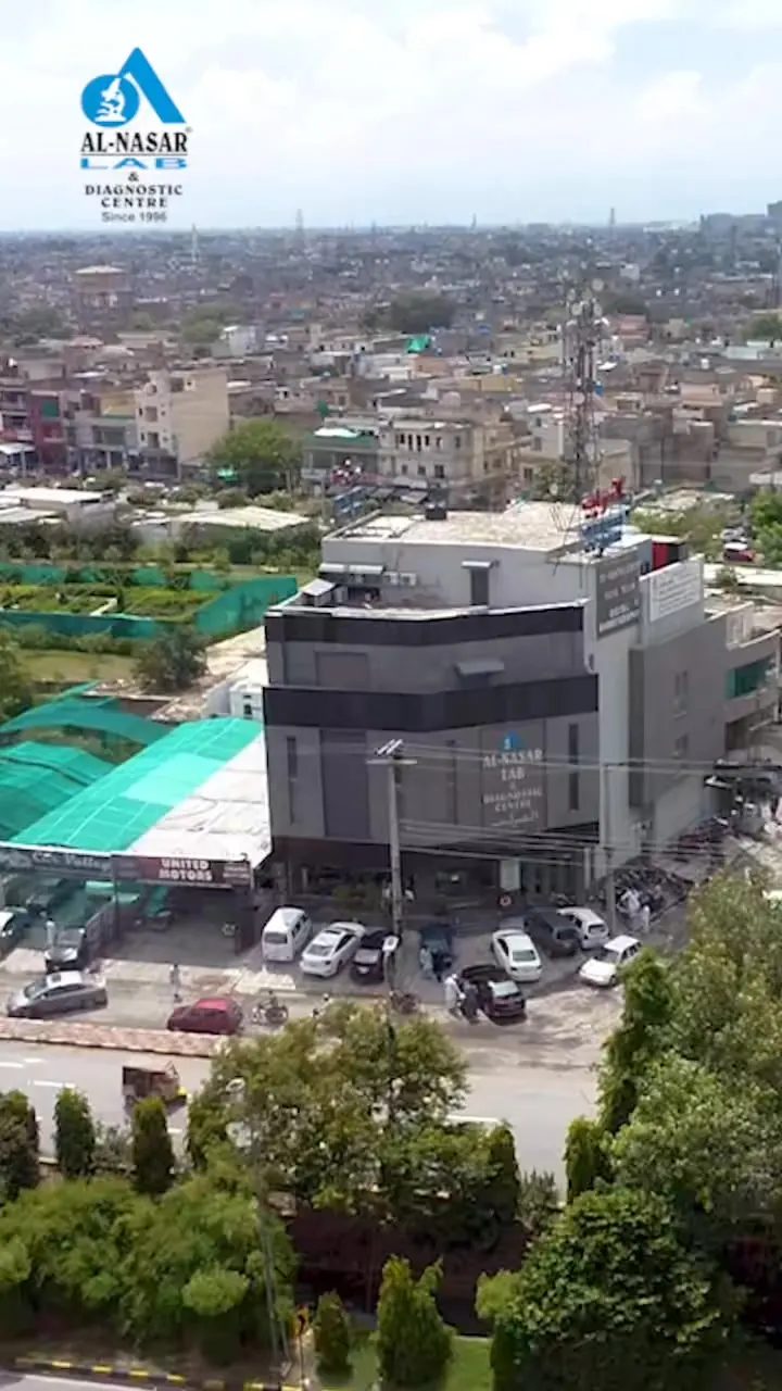 Al Nasar Lab, aerial view of clinic building among city rooftops